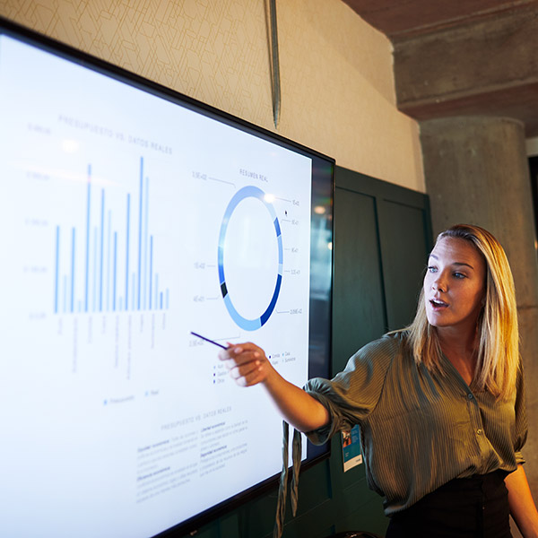 woman presenting charts